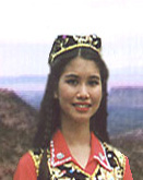 Aurumi girl in ceremonial clothing.  Photo copyright 1994 by Aimin Znapati.